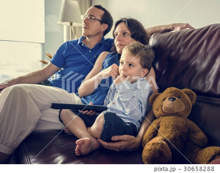 Family in a living room together. Family in a living room together. 30658288