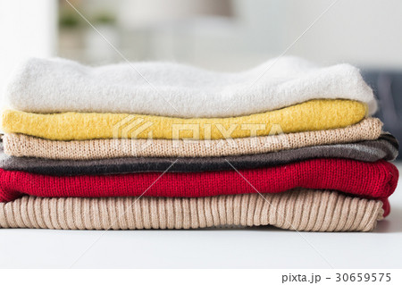 close up of stacked knitted clothes 30659575