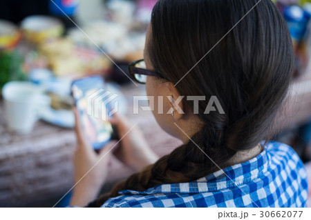 Smart girl wearing glasses using mobile phone Smart girl wearing glasses using mobile phone 30662077