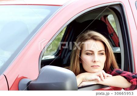 Young woman in car Young woman in car 30665953