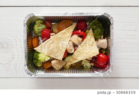 Healthy food in foil boxes, diet concept Healthy food in foil boxes, diet concept 30666359