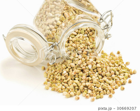 Raw green buckwheat in bank on white background 30669207