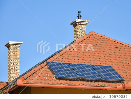 Solar panels and smoke stacks 30670085