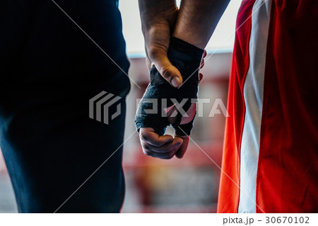 close-up hand boxer and referee close-up hand boxer and referee 30670102