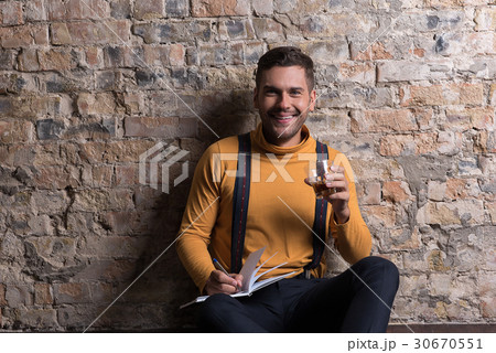 Trendy youthful male posing with joy Trendy youthful male posing with joy 30670551