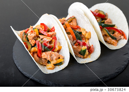 Mexican tacos with pork and vegetables. Mexican tacos with pork and vegetables. 30673824