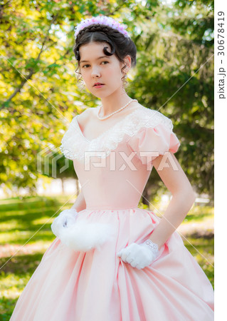 Girl in evening dress in a hurry for a meeting. Girl in evening dress in a hurry for a meeting. 30678419