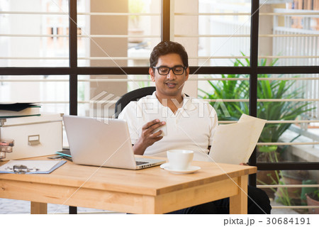 indian business male on phone conversation 30684191
