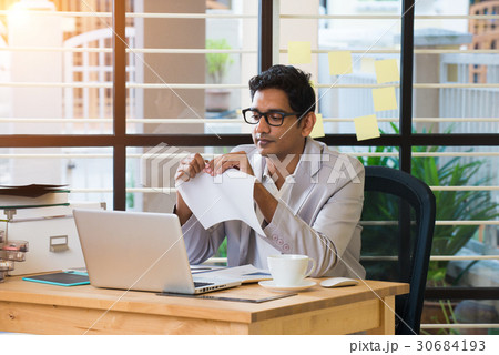 indian male typing resignation letter indian male typing resignation letter 30684193