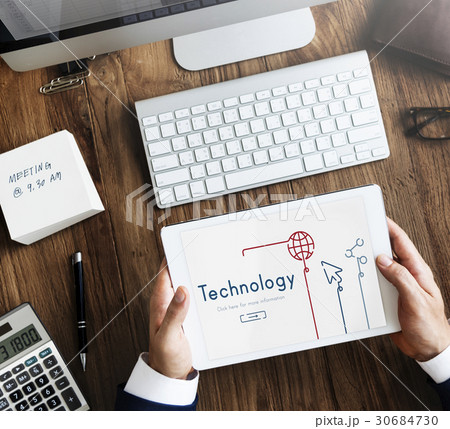 Hands working on digital device network graphic overlay 30684730