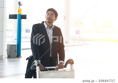 businessman at the airport with trolley 30684737