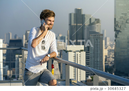 Businessman with caucasian suit Talking smart mobile phone in smile face, business lifestyle concept 30685327