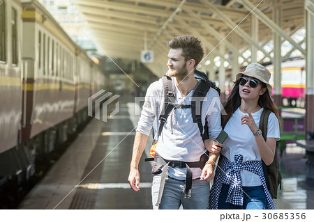 Multiethnic Travellers are walking and finding the train at the train station, Travel and transportation concept 30685356