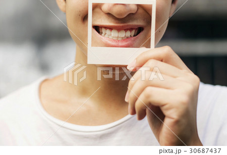 Asian Guy Holding Photo Frame Smiling Asian Guy Holding Photo Frame Smiling 30687437