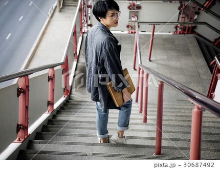 Asian Guy Walking Down Stairs 30687492