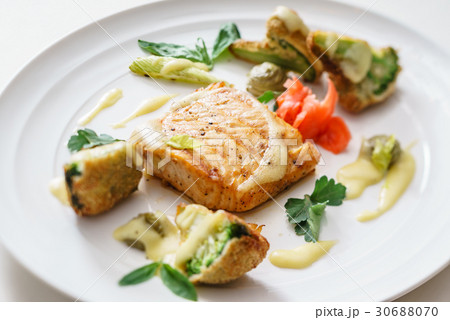 salmon steak with vegetables salmon steak with vegetables 30688070