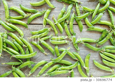 Green peas pods scattered Green peas pods scattered 30696774