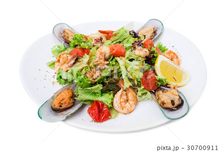 Delicious warm seafood salad. 30700911