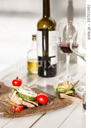 Wine, baguette and cheese on wooden background Wine, baguette and cheese on wooden background 30701061