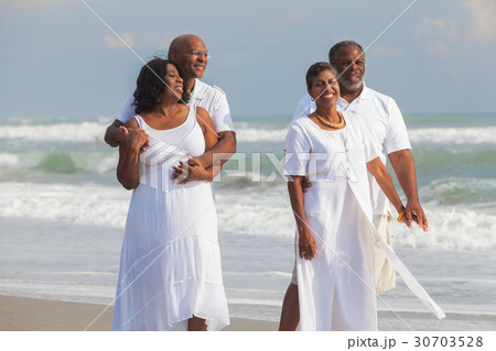 Happy Senior African American Couples on Beach 30703528
