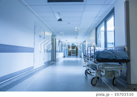 Empty Bed Gurney in Hospital Corridor 30703530