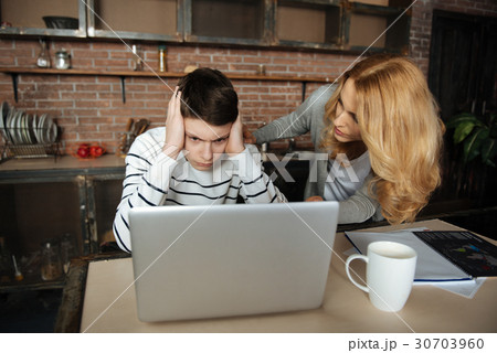 Beautiful female with curly hair bending forward Beautiful female with curly hair bending forward 30703960