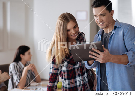 Handsome male person standing near his beautiful 30705011