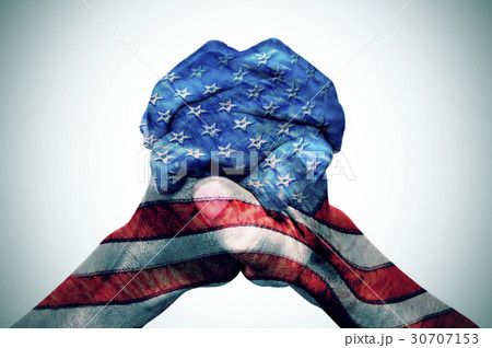 hands patterned with the US flag hands patterned with the US flag 30707153