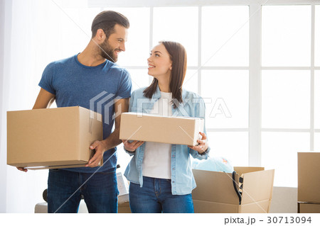 Young couple moving to a new apartment together Young couple moving to a new apartment together 30713094