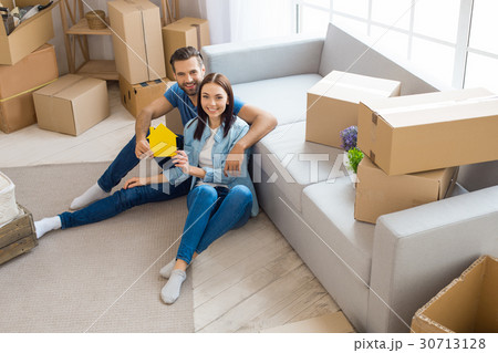 Young couple moving to a new apartment together Young couple moving to a new apartment together 30713128
