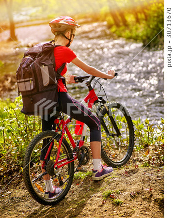 Bicycle teen with ladies bikes in summer park Bicycle teen with ladies bikes in summer park 30713670
