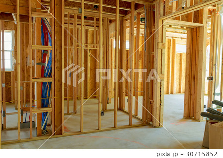 unfinished wood frame building or a house 30715852