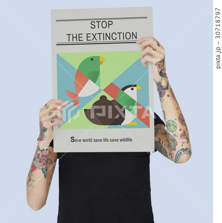 Tattooed woman with save the animals banner 30718797