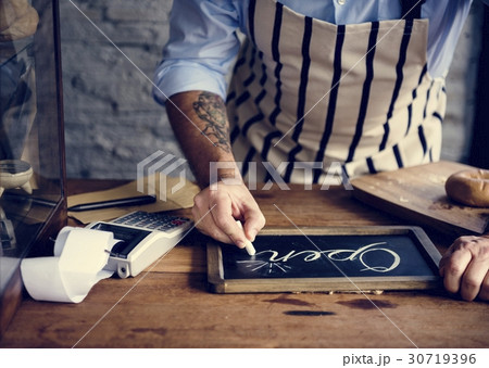 People Hand Writing Open on Chalk Board 30719396