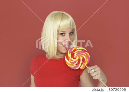 Caucasian Blonde Woman Tasting Lollipop 30720906
