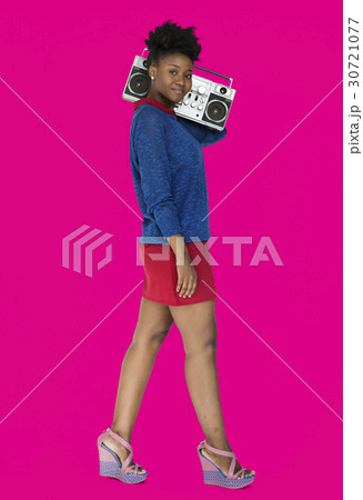 African Descent Woman Holding Jukebox 30721077