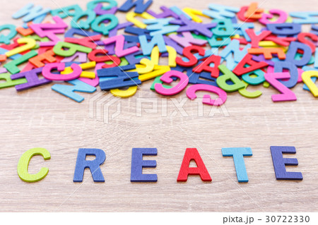 Colorful wooden alphabet and word "CREATE". Top view on grey wooden table 30722330