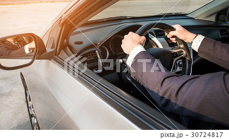 Portrait of a young handsome businessman driving a luxury sports Portrait of a young handsome businessman driving a luxury sports 30724817
