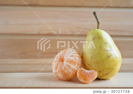 Pear and tangerines 30727738