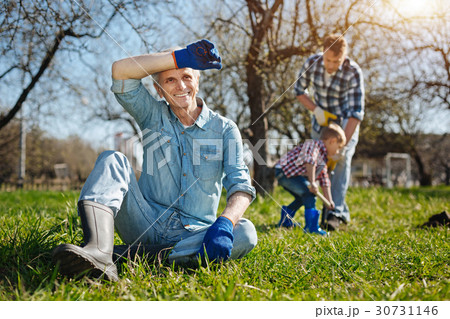 Focus on grandfather having rest after hard 30731146