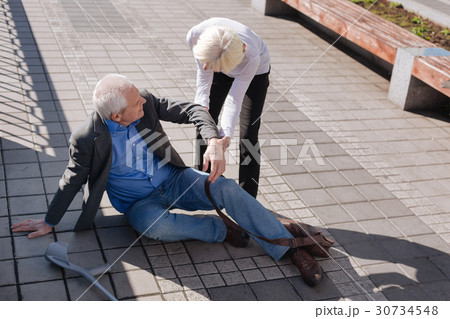 Tired aging man falling down on the road Tired aging man falling down on the road 30734548
