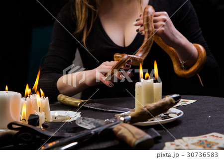 The fortune teller predicts the future with snake The fortune teller predicts the future with snake 30736583