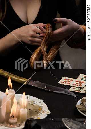 foreteller performs a ritual for money I use snake 30736587