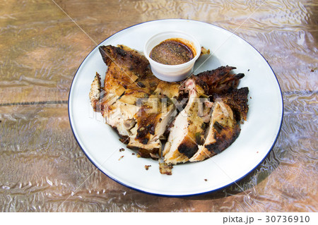 Grilled chicken on wooden background 30736910