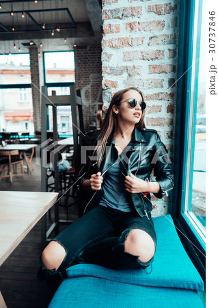 Beautiful girl in sunglasses posing on camera 30737846