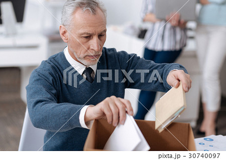 Portrait of attentive man while collecting his 30740097
