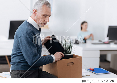 Profile photo of angry man looking sideways Profile photo of angry man looking sideways 30740126