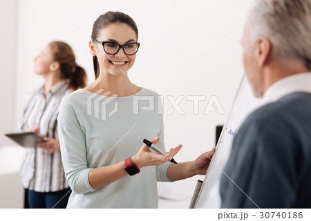Beautiful secretary presenting her excellent work 30740186