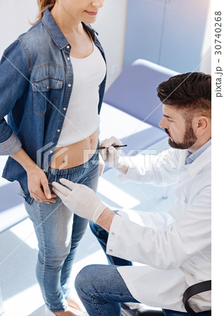 Serious plastic surgeon defining a place of the Serious plastic surgeon defining a place of the 30740268