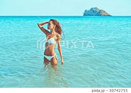 Beautiful happy slender woman at sea Beautiful happy slender woman at sea 30742755